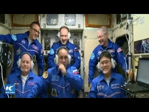 LIVE: New space crew boards International Space Station